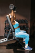 © ADDICTIVE STOCK - Woman exercising at hotel gym in blue activewear