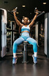 © ADDICTIVE STOCK - Woman training in hotel gym using fitness equipment