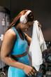 © ADDICTIVE STOCK - Woman relaxing after workout session at the hotel gym