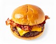 © AnnaJannah - Bright overhead shot of a gourmet bacon cheeseburger with crispy bacon and melted cheddar isolated on a white background.