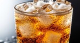 Close up of refreshing drink in glass with ice cubes and condensation