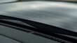 © Suyono - Close-up of a car's hood with carbon fiber texture and vents.