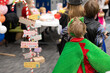 © Lost_in_the_Midwest - Children enjoy a themed event with costumes and decorations at a community center during a weekend gathering