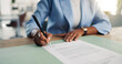© peopleimages.com - Business woman, hands and documents with signature for company agreement, policy or contract. Female person, employee or writing with application or form for recruitment process or deal in office