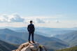 © Ariawan - Business man standing on the top of the mountain looking at the valley. Business success concept. 3d rendering.