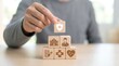 © CuteBee - Healthcare concept built with wooden blocks featuring medical icons, conveying protection and care. Ideal for health-related themes in presentations, marketing materials, or educational content.