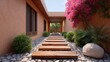 © buraratn - Peaceful garden pathway with wooden planks, rocks, vibrant blooms, and lush greenery in a serene outdoor setting for tranquil moments