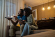 © Nenad - Couple drinking wine and watching television