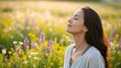 © Diclonius - A woman takes a deep, refreshing breath in a vibrant field of wildflowers, with her eyes gently closed, reflecting a moment of peace and contentment amid the natural beauty.