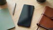 © Vadym - Top view of smartphone, pen, and notebook on wood table. Clean desk setup with mobile device, writing tools, and planner. Minimalist workspace for organization and productivity.