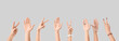 © Pixel-Shot - Many hands showing victory gesture on light background