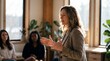 © ryker - Woman speaking to small group in cozy meeting room with natural light and plants, confident and engaged expression conveying connection and warmth