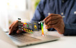 © STPDC Studio - Businessman give rating to service experience on laptop online application, Evaluate quality of service leading to reputation ranking of business. Customer review satisfaction feedback survey concepts