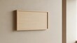 © Tumbiko - Neutral room interior featuring a blank wooden sign hanging on wall