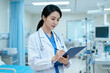 © fanjianhua - Female Doctor in Hospital Writing Medical Notes