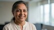 © Isaque Taylor - Authentic Portrait of a Smiling Senior Indian Woman with Grey Hair