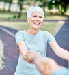 © Lumos sp - Happy active senior couple, portrait of an elderly woman with her husband dancing or swinging and holding hands and exercising  in park outdoors