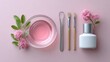 © Jane_S - Pink skincare: bowl, brush, flowers, and bottle on soft background