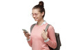 © Damir Khabirov - Happy young female student using smartphone with backpack, looking down