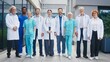 © VAKSMANV - Medical team standing outside clinic smiling and looking directly at camera. Group posing together showing unity and confidence. Professionals presenting friendly attitude during calm moment.