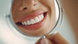 © Iaroslav - Woman admiring perfect white teeth in mirror, showing beautiful smile confident and health dental