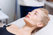 © wedmoments.stock - Middle-aged woman lying on a couch in a cosmetology center before a cosmetic procedure. Concept beauty care, skincare, aesthetic medicine
