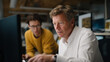 © forenna - A vibrant consulting session occurs in a high-tech laboratory where experts present results from a laser scan, showcasing its application for historical preservation and site analysis projects.