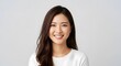 © florynstudio3 - A portrait of a woman with long, dark hair, smiling broadly against a plain gray backdrop