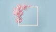 © Husen - Cotton candy explosion entering a white square frame on a light blue background