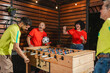 © STOCKEROcr - red team teammates mocking their opponent after a dominant foosball play