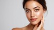 © buraratn - Beautiful young woman with flawless skin and natural makeup, showcasing her glowing complexion and captivating green eyes for beauty and skincare concepts