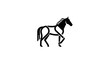 © dimas - Black silhouette of a horse in motion against a white background