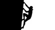 © Alis - Silhouette of a rock climber ascending a steep wall depicting strength and determination