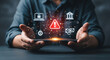 © DA_STOCK - Cybersecurity alert and data breach concept, digital security warning on smartphone, financial fraud and hacking risk icons in hands