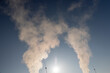 © rsooll - white steam coming from a pipe during heating of a large industrial premises in cold weather