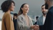 © liliyabatyrova - A woman shakes hands with a man in a suit