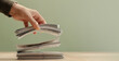 © blacksalmon - Hand releasing bundles banknotes falling onto stack. Concept of spending, cash flow