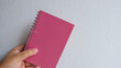 © Wanisa - Minimal pink notebook flat lay for modern lifestyle and planning.