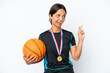 © luismolinero - Young basketball player woman isolated on white background with fingers crossing and wishing the best