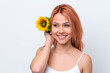 © luismolinero - Young Russian girl isolated on white background holding a sunflower while smiling. Close up portrait