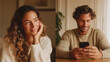 © Lumi Stock Studio - A dual-image layout of a young man talking on a smartphone and a young woman smiling warmly, representing a long-distance relationship or a romantic phone conversation.