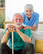© Lumos sp - Portrait of a senior doctor or nurse caregiver talking consultation with senior man at home or nursing home