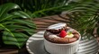 © Dream Pixel - Decadent homemade chocolate souffle in a white ramekin, topped with powdered sugar and fresh raspberry, celebrating national chocolate souffle day on a sunny outdoor table.