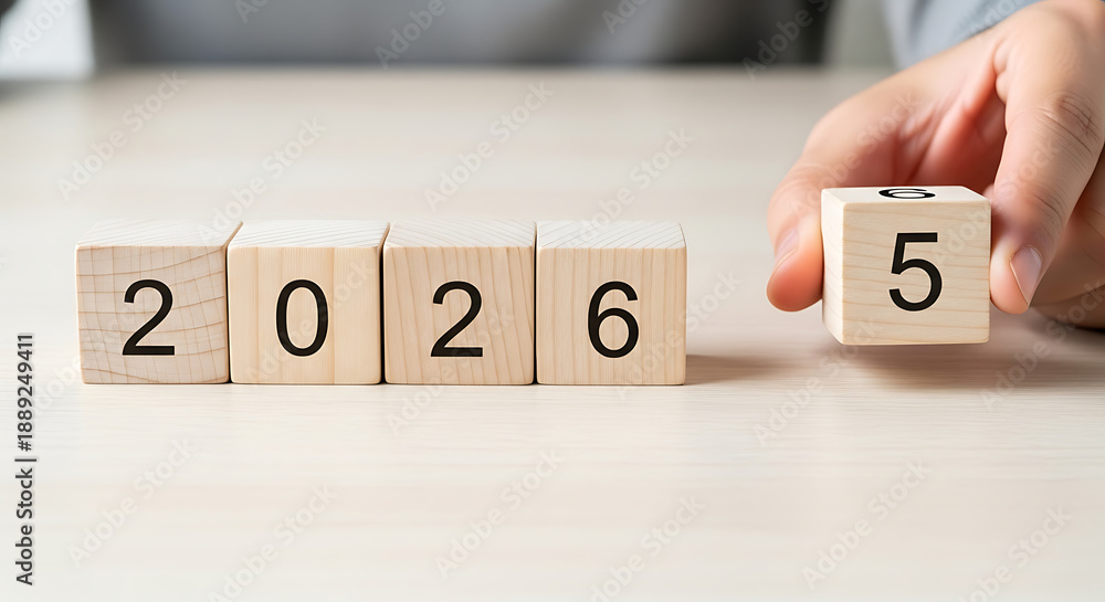 Transitioning from 2025 to 2026 with wooden blocks symbolizing the ...