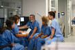 © Carmen - Medical team reviewing data together in a modern hospital setting