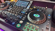 © nisara - A DJ controller and mixer setup with dual jog wheels
