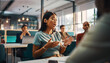 © True Stock - Young Asian Woman Engages in Lively Discussion During Business Meeting.