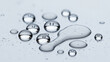 © gabriel - Close-up of clear water droplets on a white surface, reflecting light and varying in size and shape