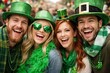 © Jafree - Four young adult friends happily celebrating St Patricks Day. Group of happy people festive atmosphere and cheerful holiday spirit