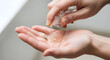 © pjdesign - Close up view of hands using antiseptic liquid for hygiene and health protection